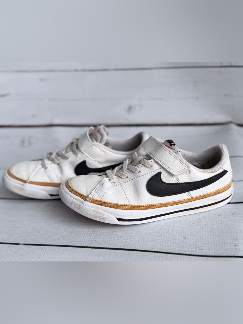 Nike Kids White Sneakers with Black Swoosh and Tan Accent